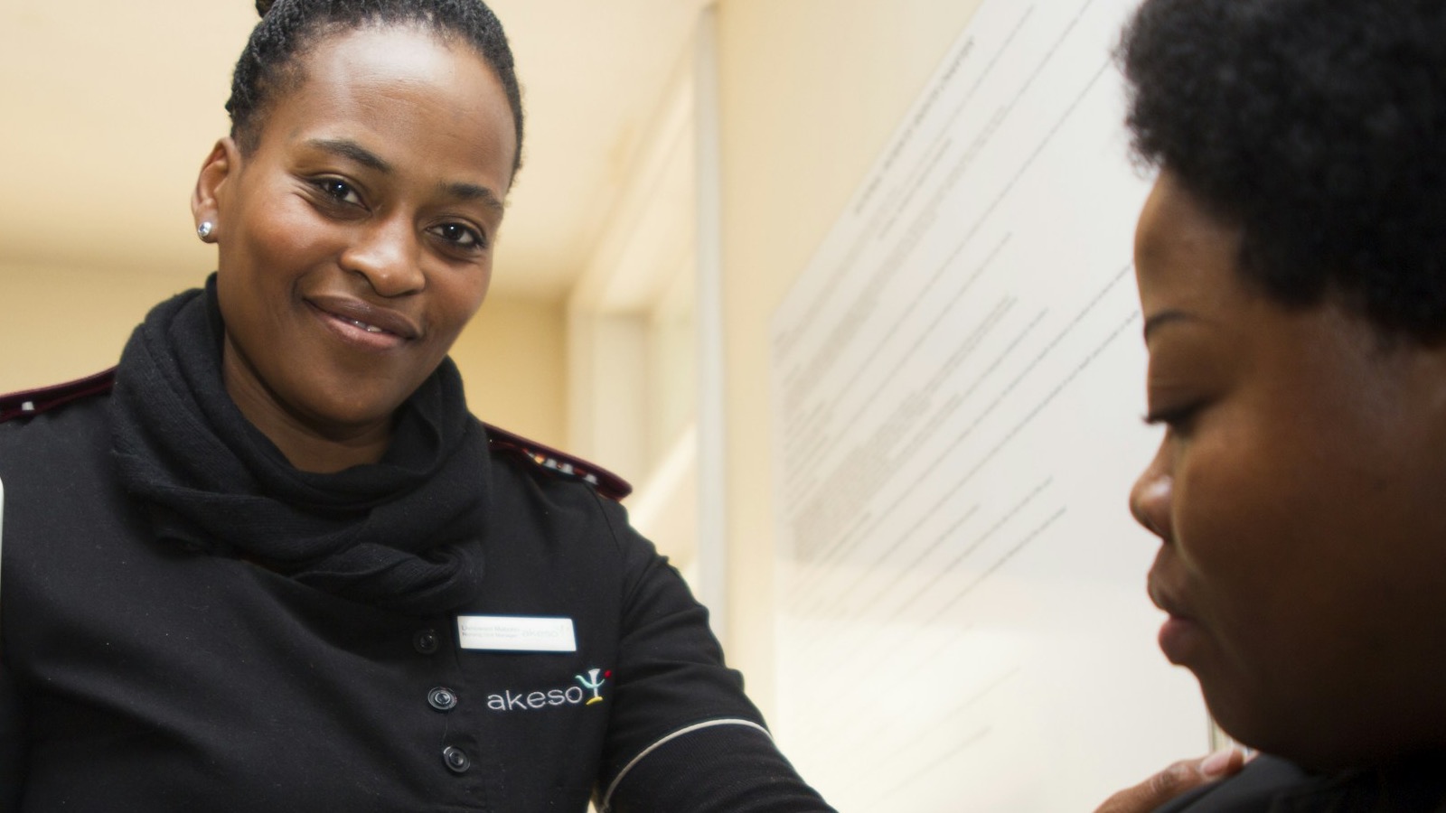 A MedicSupport clinician taking a patient's blood pressure